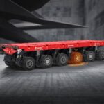 Schematische Darstellung eines SPMT-Schwerlastmoduls von Scheuerle. Eine Pendelachse ist optisch hervorgehoben, um die Reifendruckkontrolle zu illustrieren